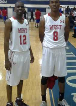 Two men standing next to each other on a basketball court.