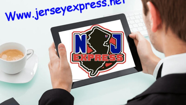 A man holding an ipad with the nj express logo on it.