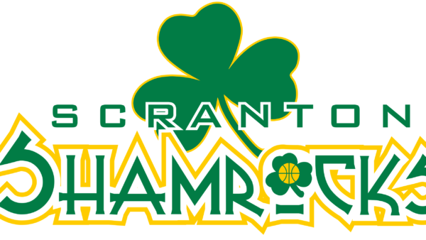 A green and yellow shamrock with the words " scranton shamrocks ".